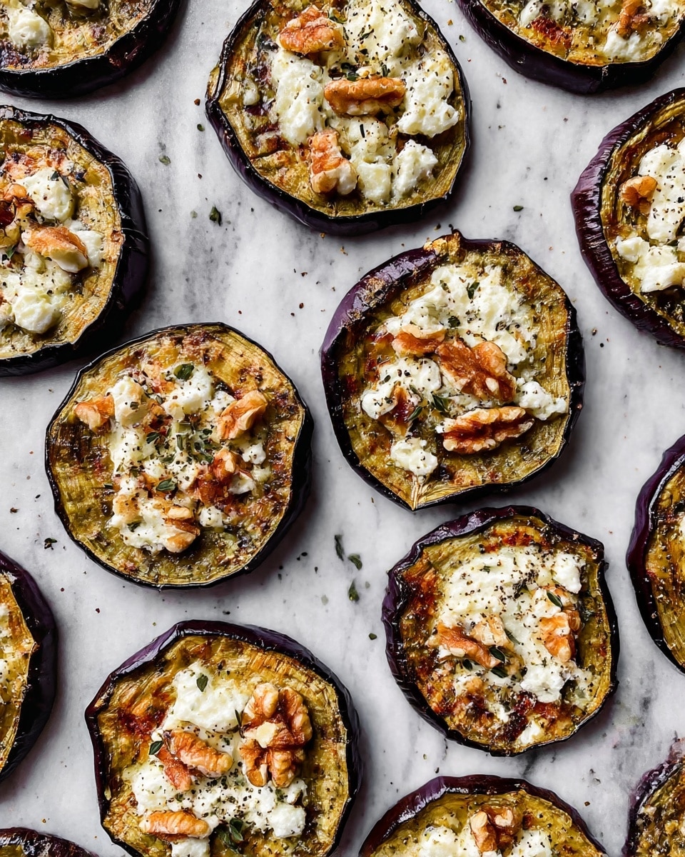 The image shows several round slices of roasted eggplant spread out on a white marbled surface. Each eggplant slice has a dark purple edge with a soft, golden-brown center. On top of every slice, there is a layer of crumbled white cheese mixed with small pieces of light brown walnuts and sprinkled with tiny green herb leaves and black pepper. The textures of the melted cheese and crunchy nuts add detail to the smooth roasted eggplant base. photo taken with an iphone --ar 4:5 --v 7