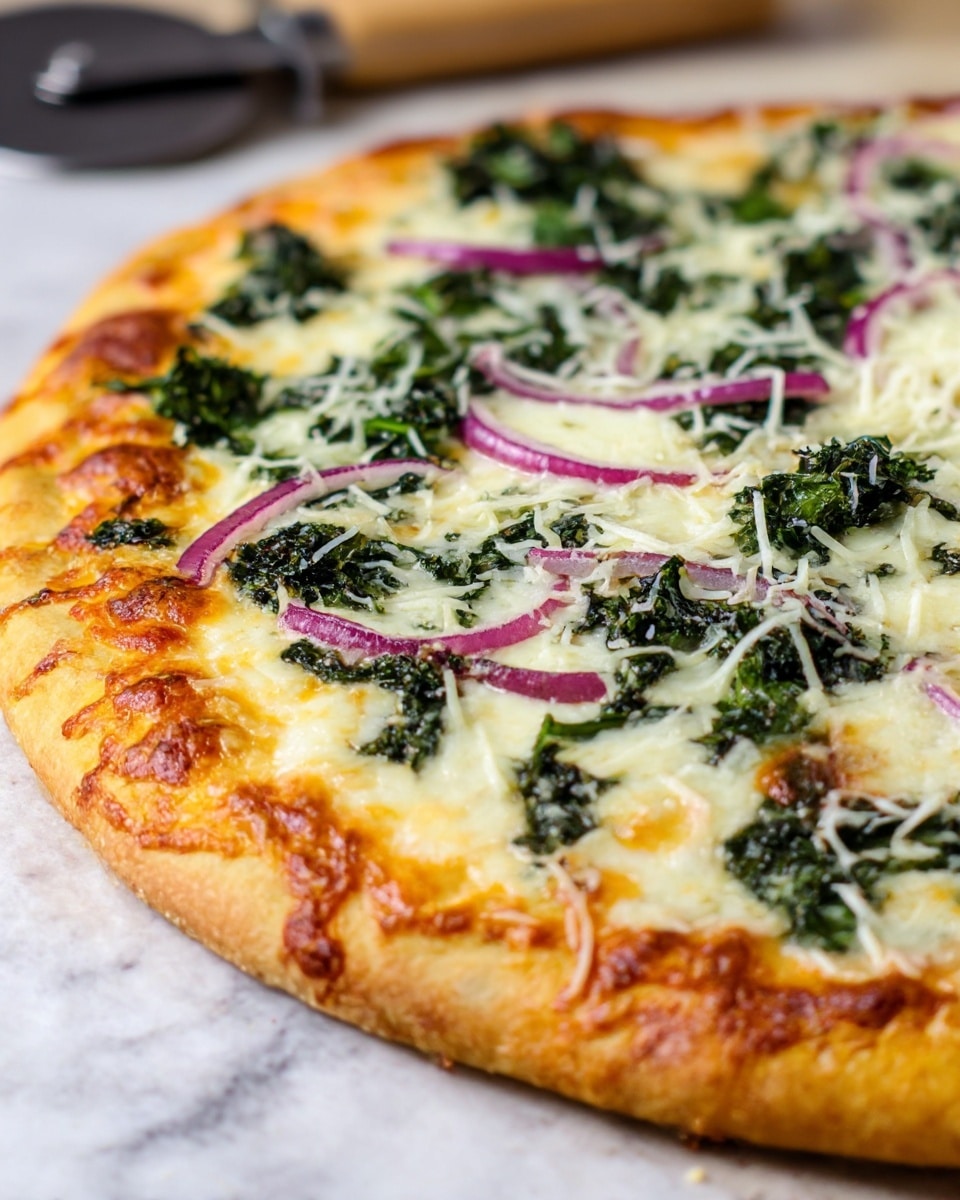 A close-up view of a pizza on a white marbled surface showing a thick crust with a golden-brown color and melted cheese bubbling on top. The pizza has a first layer of smooth white melted cheese covering the crust. On top of the cheese, there are scattered dark green leafy vegetables, and thin slices of red onion rings spread evenly across the surface. Some shredded cheese is sprinkled over the top, adding texture and a light dusting of white. The edges of the pizza crust are slightly puffy and browned, showing a toasted texture. A pizza cutter is blurred in the background. photo taken with an iphone --ar 4:5 --v 7