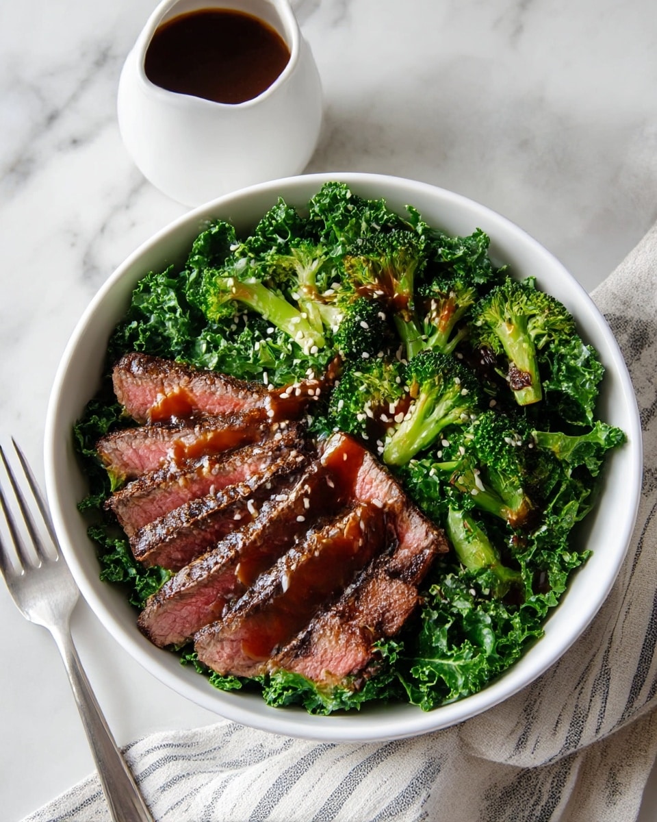 A white bowl sits on a white marbled surface, filled with a fresh salad in three layers: the bottom layer is curly green kale, topped with bright green, slightly charred broccoli florets, and on top are several slices of medium-cooked steak, showing a pink center and seared edges. A glossy, dark brown sauce is drizzled over the steak and vegetables, sprinkled with white sesame seeds. Nearby is a white sauce pitcher and a fork resting on the surface, with a striped cloth partially visible. Photo taken with an iphone --ar 4:5 --v 7