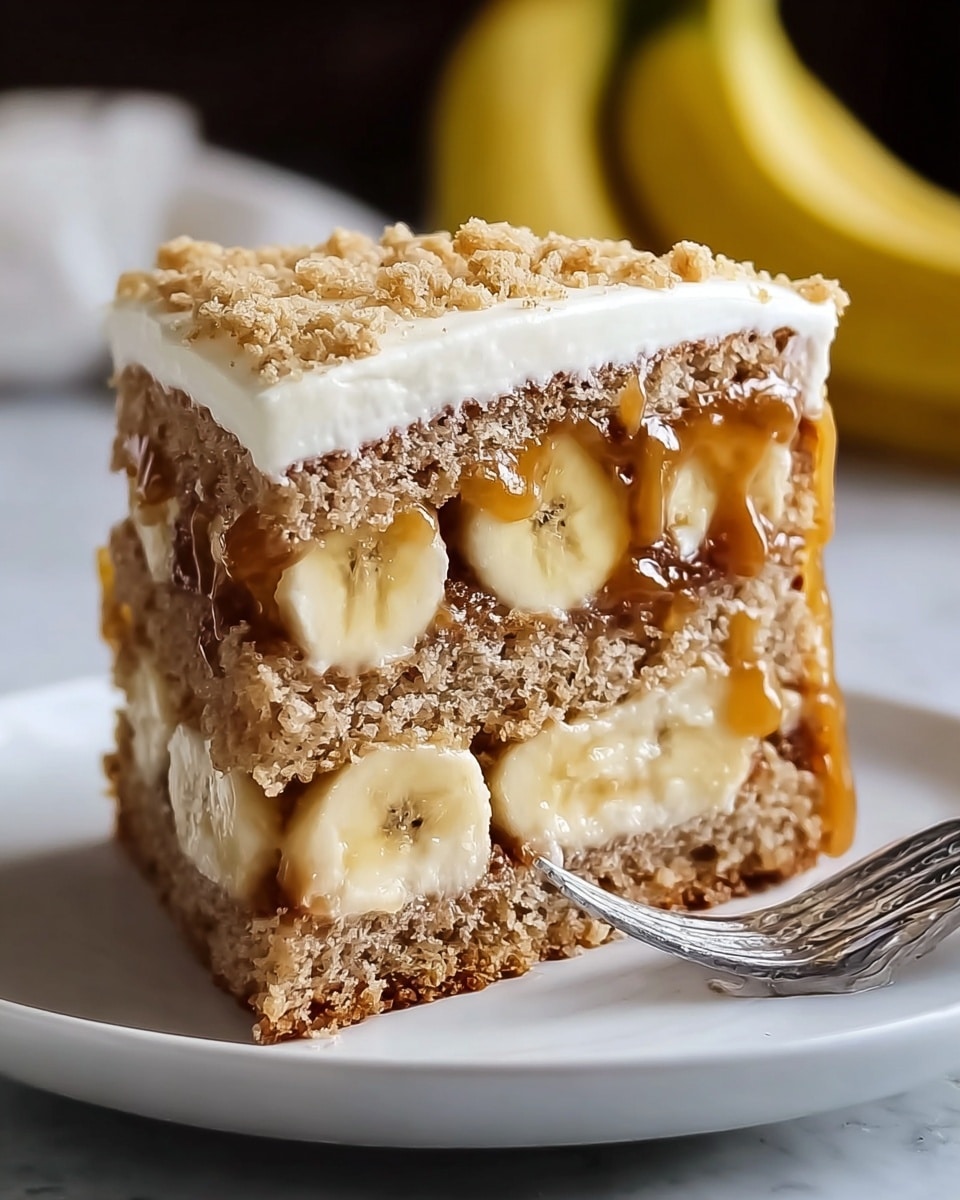 A slice of layered banana cake is shown on a white plate sitting on a white marbled surface. The cake has three main layers: the bottom and middle layers are dense, brown cake with a slightly crumbly texture. Between these cake layers is a middle layer of banana slices arranged horizontally, surrounded by a glossy caramel or syrup layer that glistens and holds the banana in place. The top layer is a smooth, creamy beige frosting with a scatter of crumbly topping, which appears light brown and somewhat coarse. The background is softly blurred with hints of yellow bananas. photo taken with an iphone --ar 4:5 --v 7