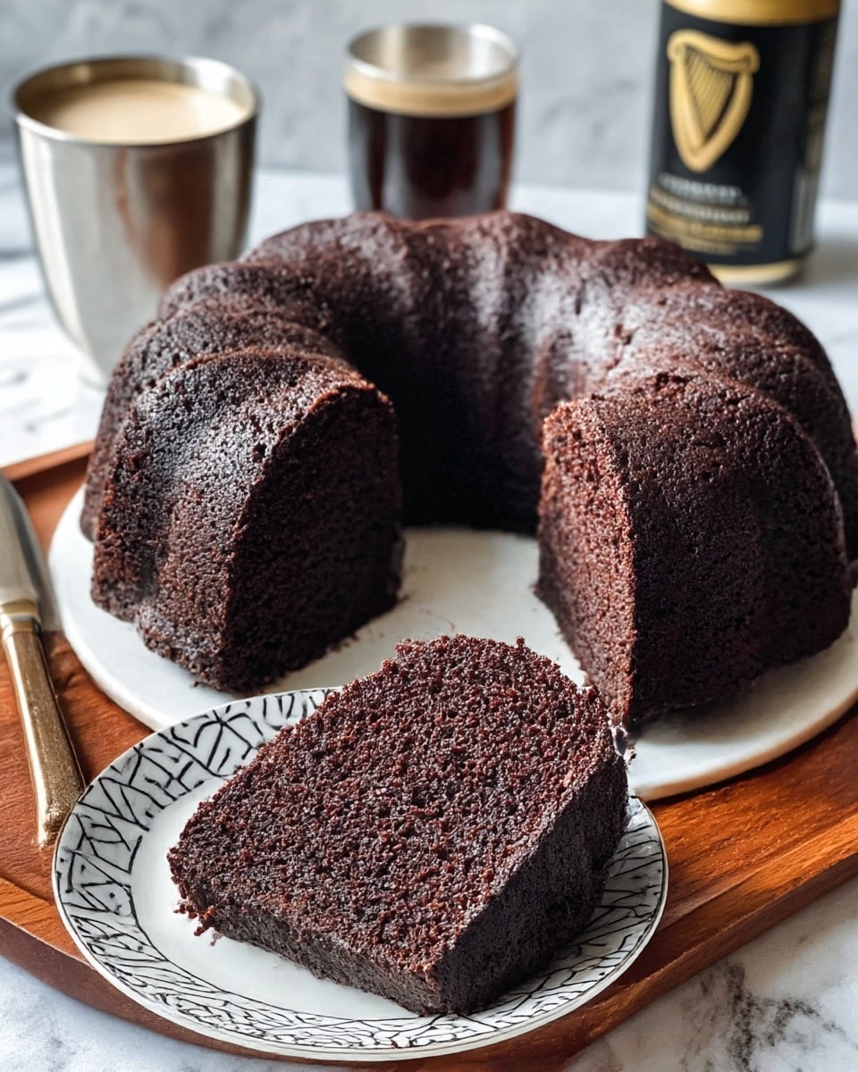 A thick, dark chocolate bundt cake with a rough, moist texture is shown with one large slice cut out and placed on a white plate with a black geometric pattern. The cake is on a brown wooden tray, and a knife rests inside the cake ring. The background includes a silver metal cup and a can with black and gold colors. The surface is a white marbled texture. Photo taken with an iphone --ar 4:5 --v 7