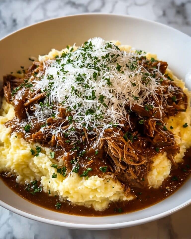 Tender Short Rib Ragu Over Silky Parmesan Mashed Potatoes Recipe