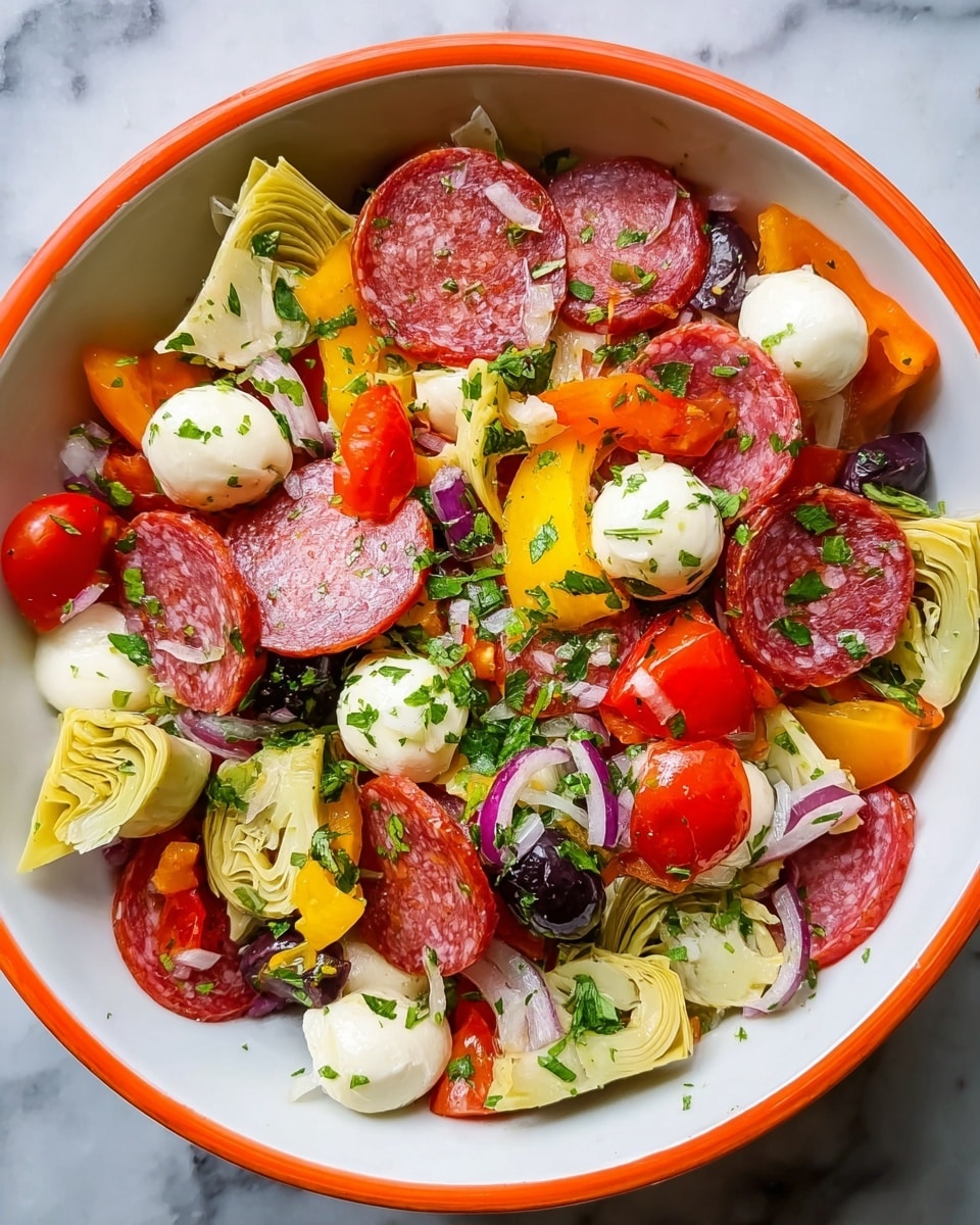 In a white bowl with an orange rim, there is a colorful salad made of several layers: thin slices of reddish-pink salami spread across the top, round white mozzarella balls scattered evenly, quartered cherry tomatoes showing a mix of red and orange shades, chunks of bright yellow bell peppers, light green artichoke hearts with visible layers, and dark purple olives nestled around. The salad is sprinkled all over with finely chopped green herbs, adding a fresh texture. Small bits of red onion are also mixed in, adding purple tones. The ingredients look fresh and moist, arranged in a casual but balanced way. The bowl sits on a white marbled surface. photo taken with an iphone --ar 4:5 --v 7
